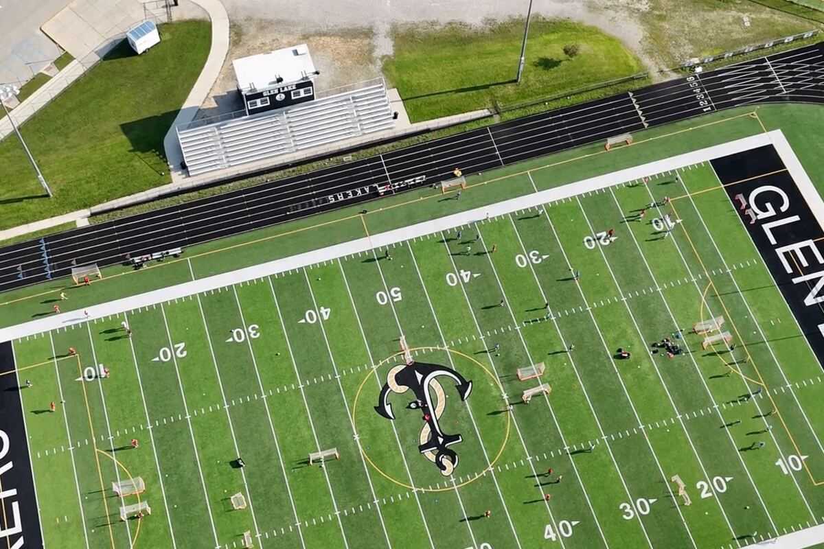 Glen Lake’s stadium field from the air, with small groups of campers spread across it